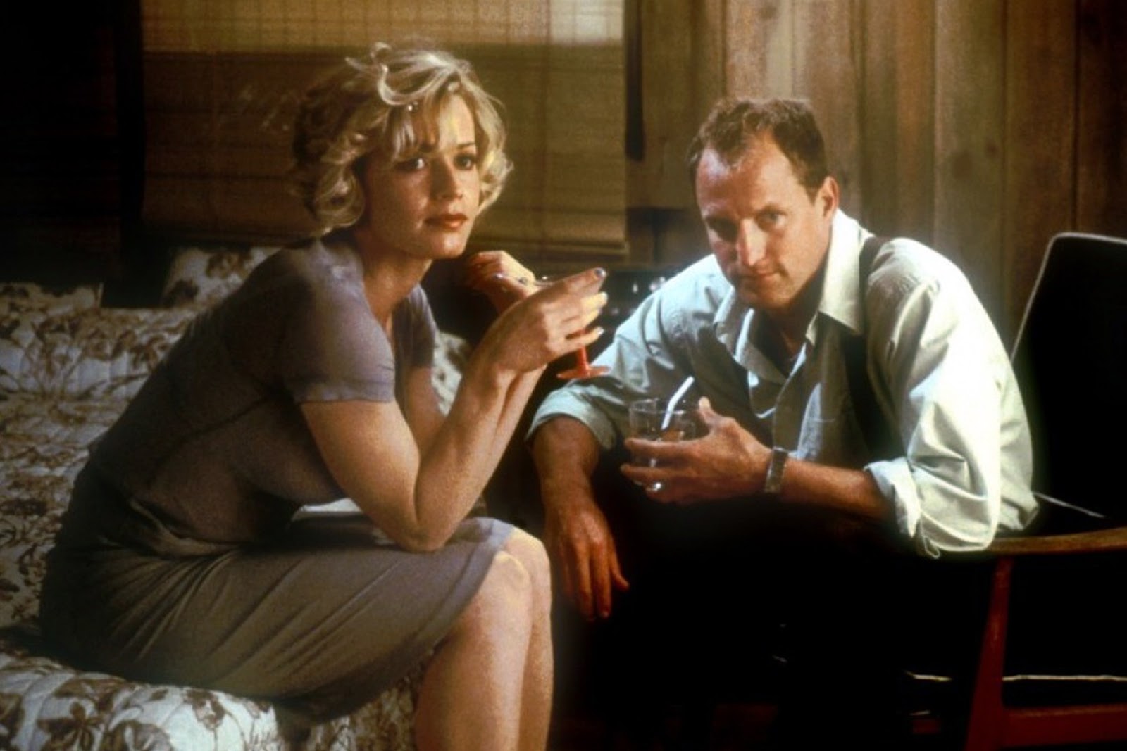 Woody Harrelson as Harry Barber and Elisabeth Shue as Mrs. Donnelly / Rhea Malroux